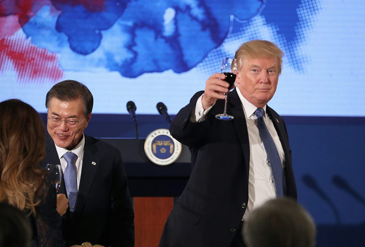Image result for   U.S. President Donald Trump raises his glass in a toast at the start of a dinner in Seoul, South Korea. (AP Photo/Andrew Harnik)