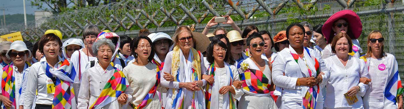 An international delegation, along with women from North and South Korea, walked together along the DMZ (Demilitarized Zone) in 2015, advocating for an end to the Korean War and reunification on the 70th anniversary of the division of the Korean peninsula. womencrossdmz.org