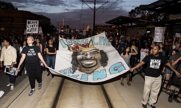 Protesters carry a banner depicting Philando Castile on June 16, 2017 in St. Paul Minnesota. Photo Stephen Maturen, Getty Images