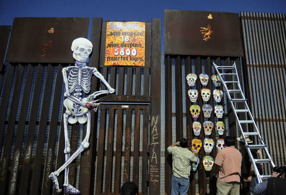 Art created on the border wall for Dia de los Muertos in 2012, commemorating the deaths of immigrants attempting to cross from Mexico to the US. Photo: TV Azteca